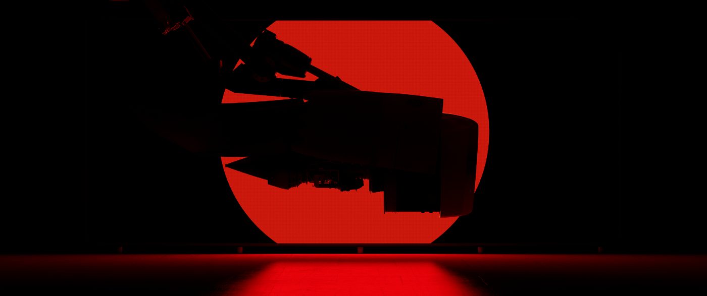 Engine silhouette against a red disc