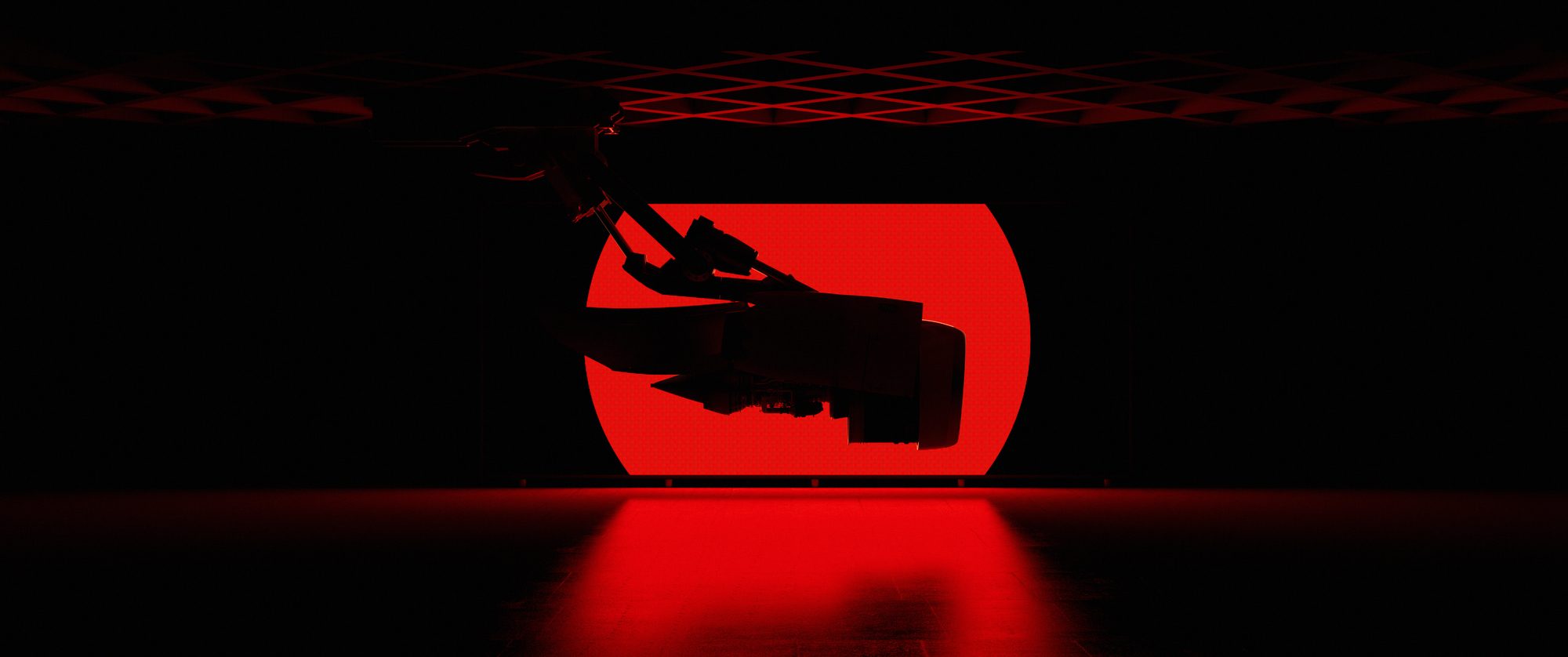 Engine silhouette against a red disc